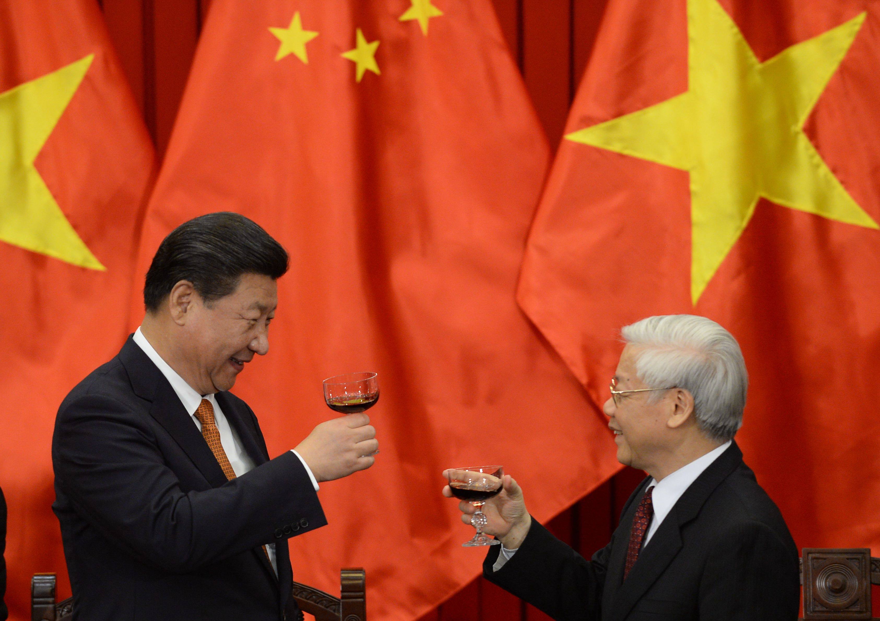 Chinese President Xi Jinping’s trip to Hanoi follows a visit to Beijing last year by Vietnam’s Communist Party chief Nguyen Phu Trong (right). They pledged to take relations to a new level. Photo: AFP
