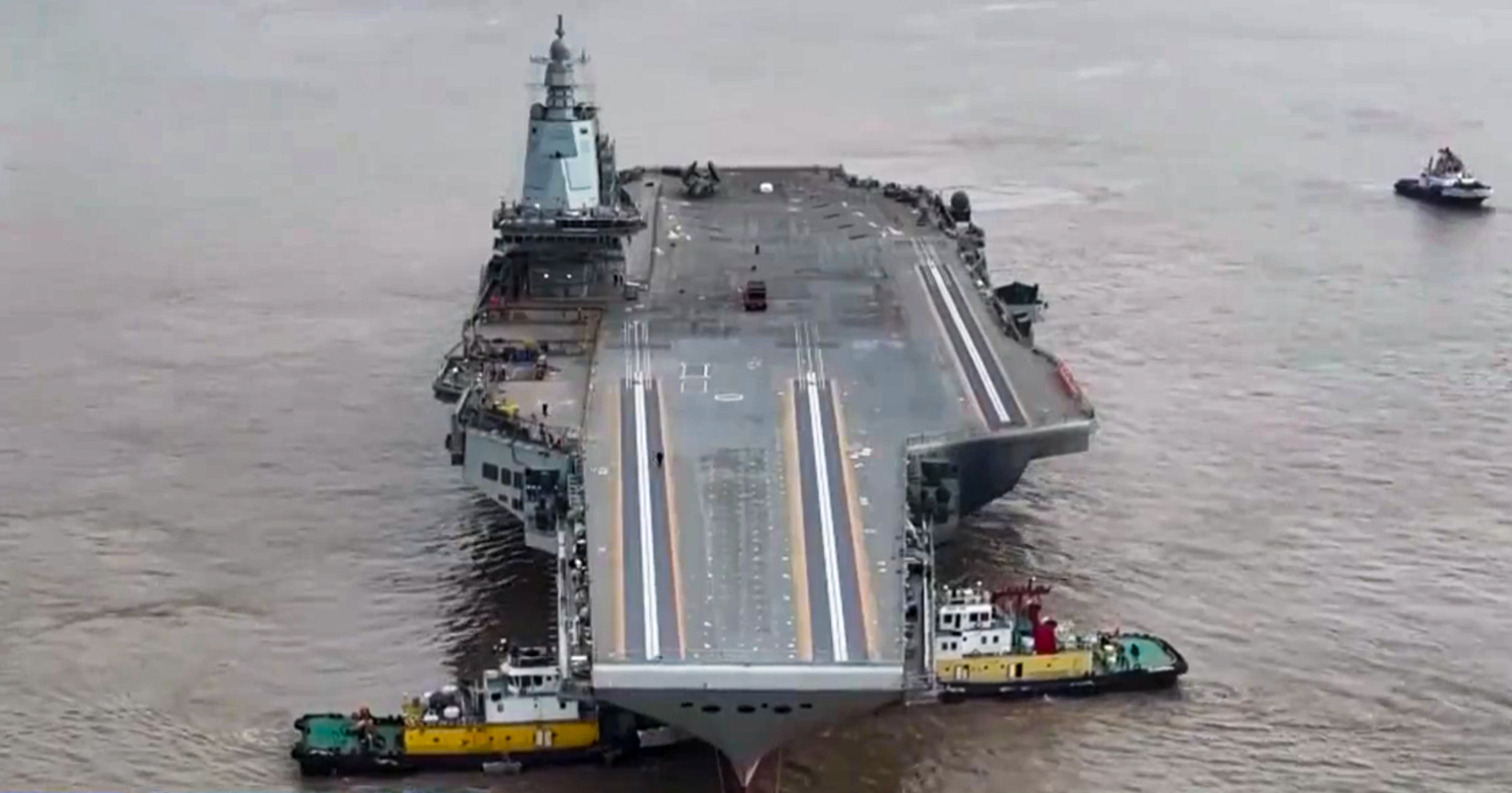 The Fujian was shown being towed by tugboats in a report on state television on January 2. Photo: CCTV