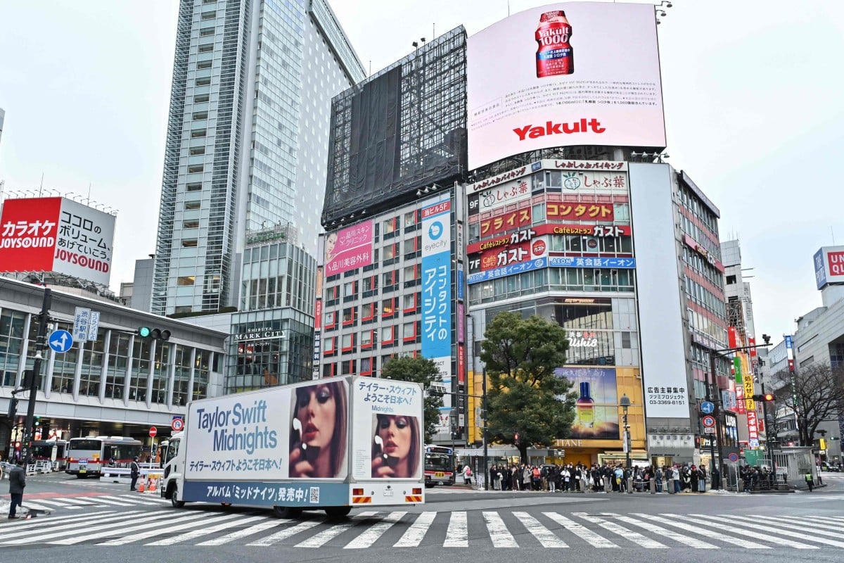 A truck, advertising the Japan tour of Taylor Swift, drives through Shibuya Crossing in Tokyo on February 6. Photo: AFP